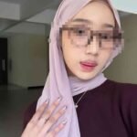 Young woman with pink hijab and sunglasses, KL escort service