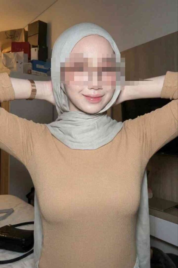 Malay woman in hijab and tan top